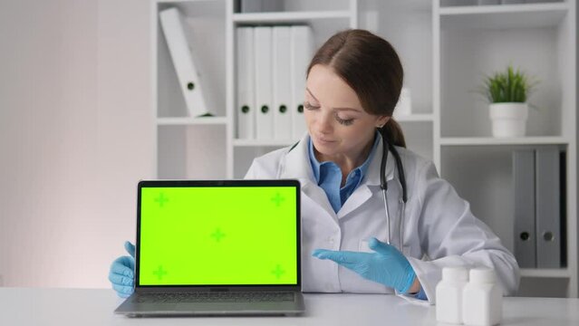 A psychotherapist with a tracked eye and a computer with a green screen chroma key, ready to provide clients with psychological support and assistance in solving personal issues remotely.