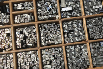 Metal type sorts in a typographical drawer