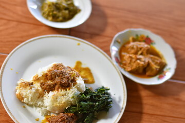 Nasi Padang with rendang is an Indonesian food from West Sumatra in Indonesia. Nasi Padang as favorites food for Indonesian people.

