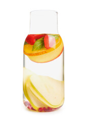 Bottle of infused water with different sliced fruits on white background