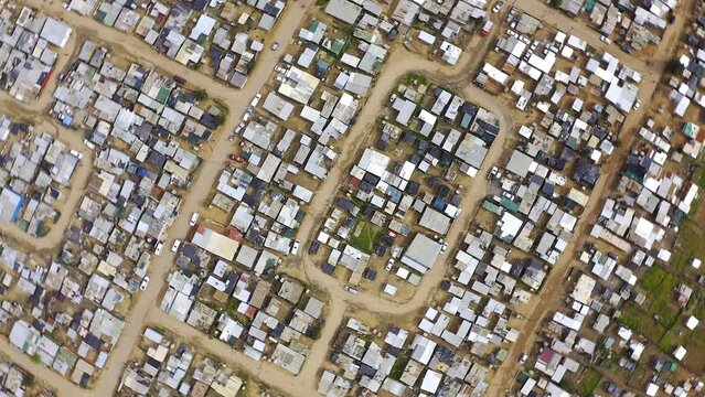 Drone, houses rooftop in township with infrastructure and neighborhood in South Africa. Street, building and landscape with road or pathway, aerial view of suburban or residential land with geography
