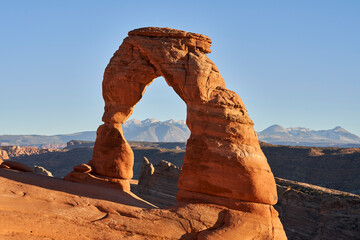 The delicate arch in Arches national park is 52 feet tall, and is a free-standing natural rock...