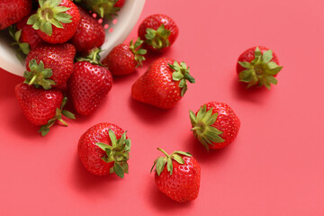 Fresh strawberries on red background