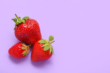 Fresh strawberries on lilac background