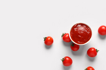 Bowl with tomato paste and fresh vegetables on white background