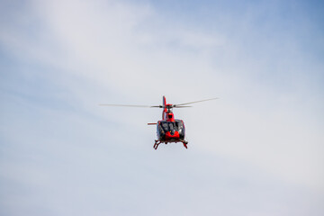 Fototapeta na wymiar Red Eurocopter over Melbourne