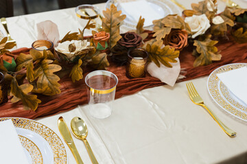 table decorations from a recent fall wedding fall leaves and candles