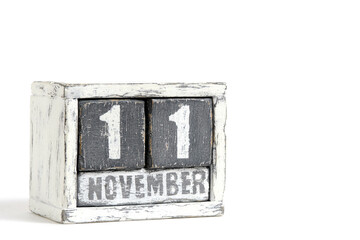November 11 on wooden calendar, on white background.
