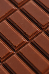 Bar of delicious milk chocolate closeup.
