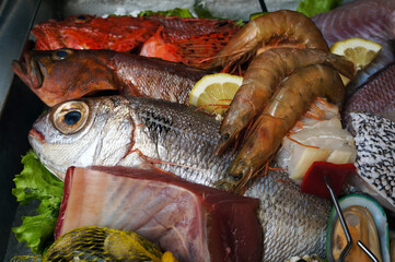 Fresh Raw Atlantic Saltwater Fishes and Prawns in Seafood Restaurant.