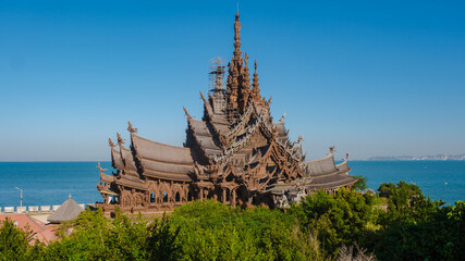 The Sanctuary of Truth wooden temple in Pattaya Thailand is a gigantic wooden construction located...