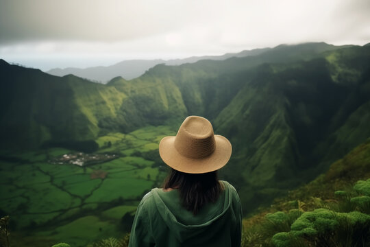 Adventurous Vista: Woman Explorer, Hat Adorned, Captivated by Majestic Mountains and Enchanting Forest