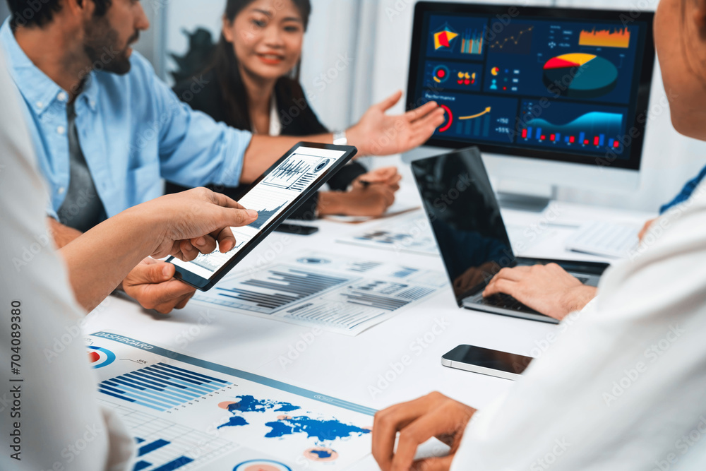Fototapete analyst team uses bi fintech display tablet to analyze financial data . business people analyze bi s