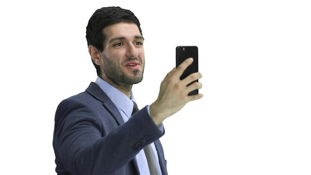 Close-up of a man in an office suit on a White background talking on the phone