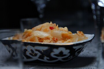 Sauerkraut in a plate on the table or in Asian style chimcha kimchi. 