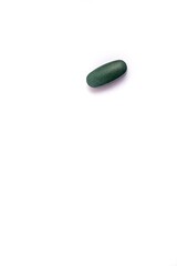 Green pill isolated on white background. Medical drugs pills. Medical, pharmaceuticals, healthcare concept