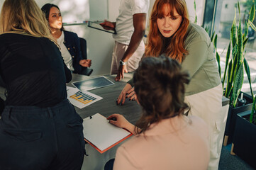 An inclusive diverse team is working on global market research.