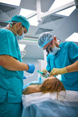 Plastic surgeons work in the operating room