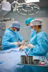 Plastic surgeons work in the operating room