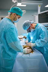 Plastic surgeons work in the operating room