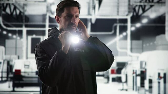 Security Guard At Night With Flashlight
