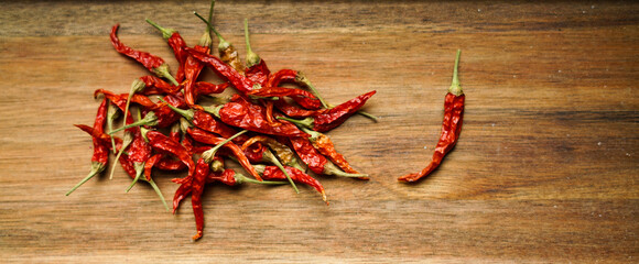 Red chilli peppers on the wooden board. 