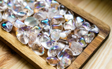 NAtural aura quartz on the wooden background. 