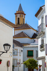 Walking in city center on sunny summer day in Estepona, Spain