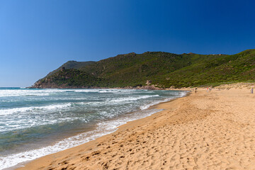 The Porto Ferro beach, in northwest Sardinia near Alghero, during a windy summer day with rough sea