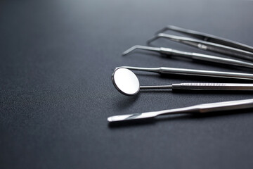 Dental tools on black background