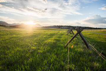 Sunset Over Remote Ranch Fenceline