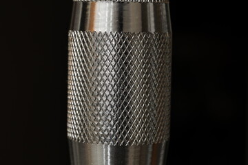 Close-up of a metal object with textured pattern
