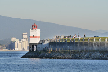 Beautiful view of the Brockton Point Lighthouse at Stanley Park during a fall season in Vancouver,...