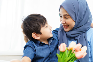 Happy cheerful Asian muslim family living together in a weekend.