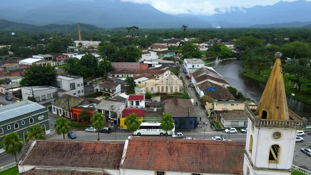 Aerial shot drone flies over the main tourist street and church in Morretes