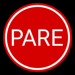 circle-shaped stop sign in Portuguese