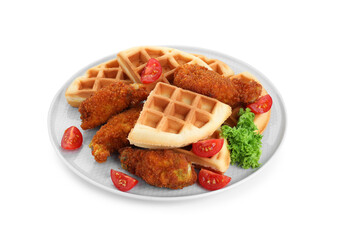 Plate with tasty Belgian waffles, fried chicken, tomatoes and lettuce isolated on white