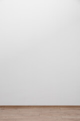 Empty white wall and wooden floor indoors, space for text