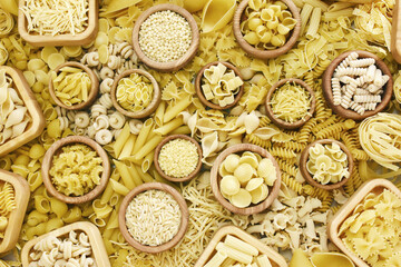 Mix of pasta shapes varieties: penne and fusilli, farfalle and macaroni, rigatoni and rotini, rigate and conchiglie