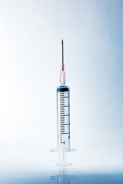 Macro syringe,A 5ml syringe and needle isolated on a white background with detailed clipping path,Close up of a syringe. Focus on numbers