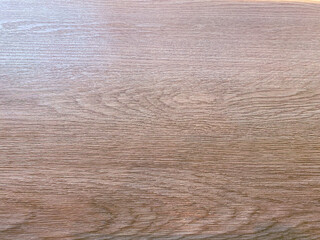 Teak wood with a rough and textured appearance, providing a raw and organic feel to designs.