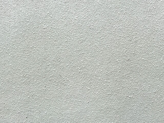 The abstract details on the cement wall make it a compelling design element.