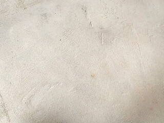 A textured wall in shades of gray, offering a neutral and sophisticated aesthetic.