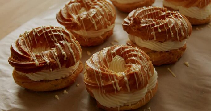Decorating pastries with iceing at a bakery 4K, healthy home-made breakfasts, bakery and pastries, production of healthy food, traditional regional specialties.