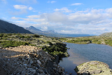 Fototapeta na wymiar An alpine lake near the summit of an Alaskan mountain