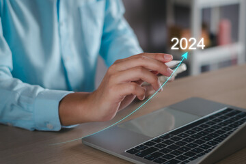 Business growth 2024 concept. Businessman analyze new year trend of future business technology, economic, marketing, opportunity investment, financial, calendar plan, business goal and success.