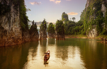 Sunset view at Khao Sok national park Cheow Lan Dam lake with blue sky background  in Surat Thani,...