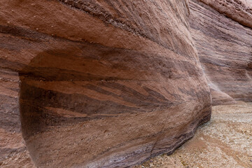 A small  niche in a rock wall on the bank of a shallow stream on the Wadi Numeira hiking trail in Jordan