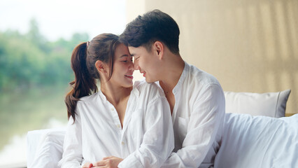 Young adult asia people fiance happy lover flirt fall in love nose lips kiss hug cuddle care trust....