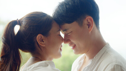 Young adult asia people fiance happy lover flirt fall in love nose lips kiss hug cuddle care trust....